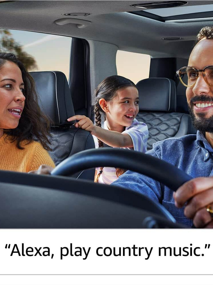 Family enjoying a car ride, using Alexa to play country music with Echo Auto.