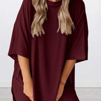 Full Size Oversized Slit Round Neck Top and Shorts Lounge Set Plus Size in burgundy color on model.