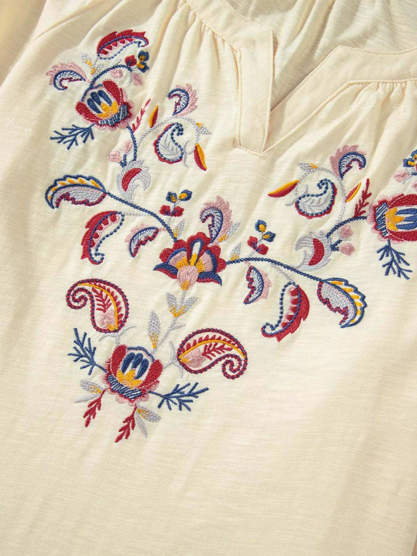Embroidered Notched Balloon Sleeve Blouse with detailed floral embroidery design on a light background.