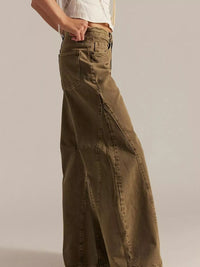 Side view of Washed Wide Leg Jeans in a relaxed fit, showcasing a pocketed design and wide leg style.