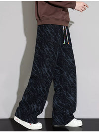 Men's Wide Leg Casual Pants featuring a stylish drawstring design and trendy pattern, perfect for casual wear.