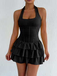 Black halter neck ruffle mini dress with tiered skirt and corset-style seams