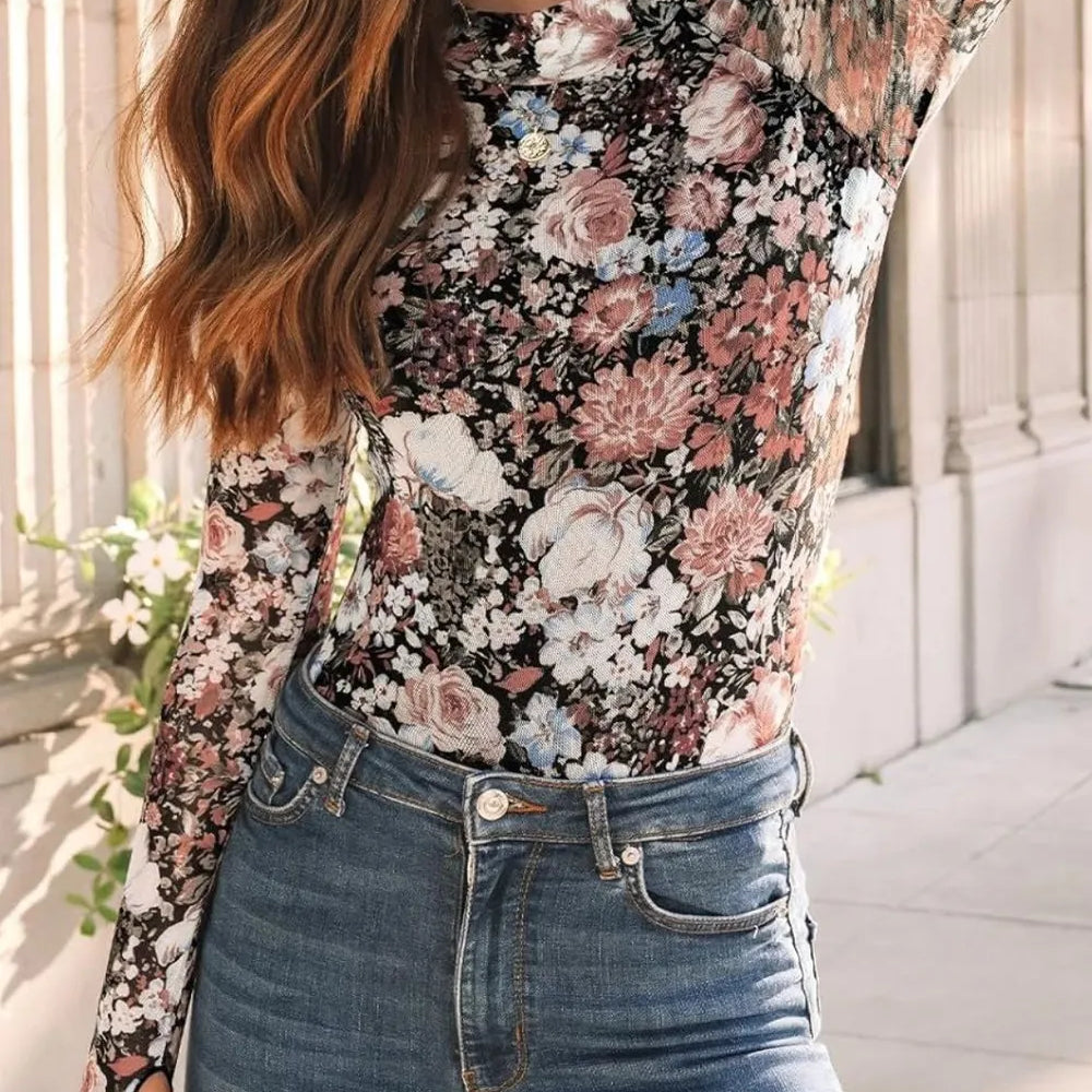 Lovelet Mock Neck Long Sleeve Top modeled with floral design and paired with jeans in a stylish outdoor setting.