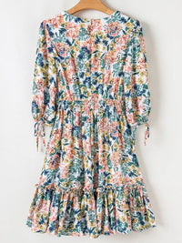 Floral Print Ruffle Hem Mini Dress featuring ruffles and a vibrant floral pattern, perfect for casual outings.