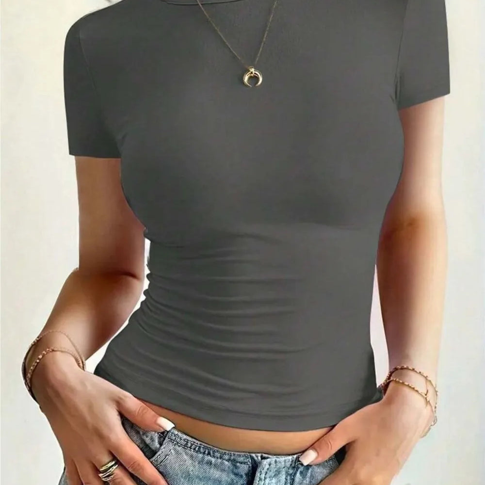 Round Neck Short Sleeve T-Shirt in gray, featuring a fitted design, worn casually with jeans and accessorized with jewelry.