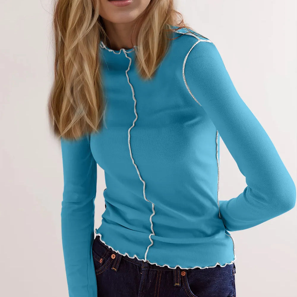 Basic Bae Contrast Trim Mock Neck Long Sleeve T-Shirt in blue worn by a model, showcasing its stretchy fabric and stylish design.
