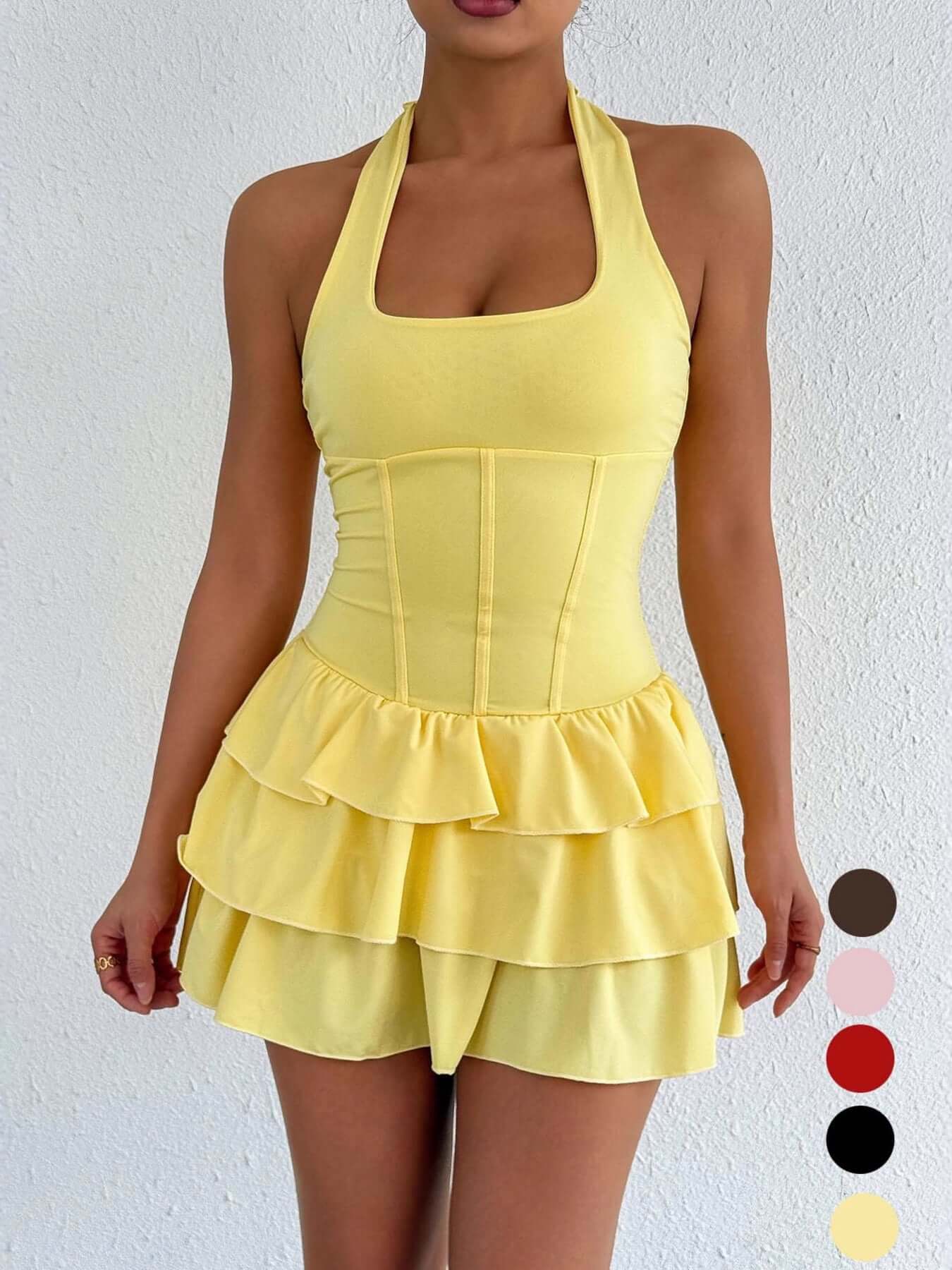 Yellow halter neck ruffle layered mini dress with tiered skirt and seamed bodice