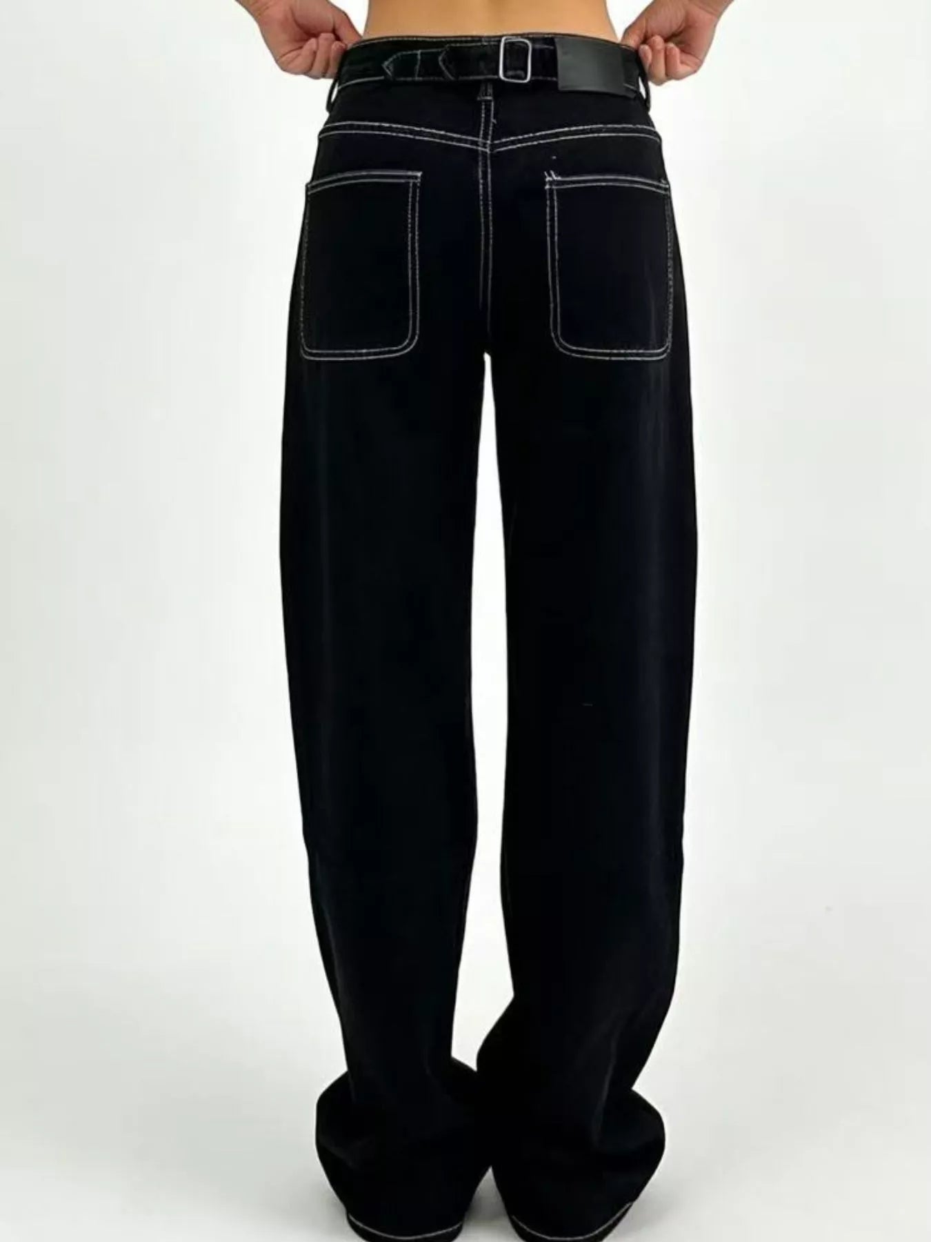 Wide Leg Washed Jeans showcasing the back view with pocket details and belt.