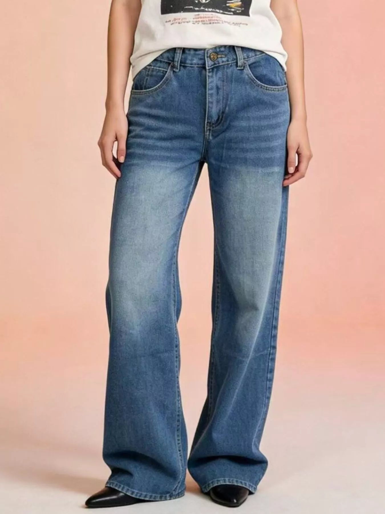 Vintage Wash Wide Leg Jeans displayed on model, featuring a trendy pocketed design and classic blue denim.