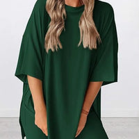 Full Size Oversized Slit Round Neck Top and Shorts Lounge Set Plus Size in dark green on a model.