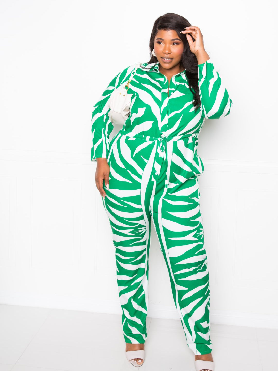 Button Up Long Sleeve Jumpsuit in green and white zebra print, showcasing a stylish and chic look for all body types.