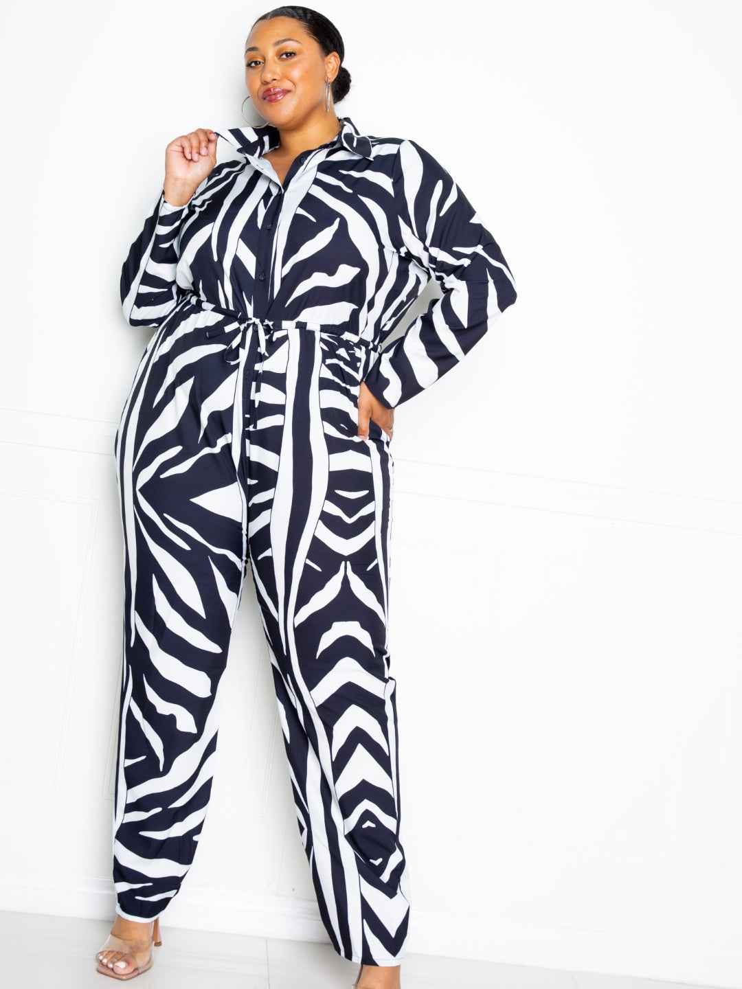 Button Up Long Sleeve Jumpsuit in stylish zebra print, perfect for a chic and sophisticated look.