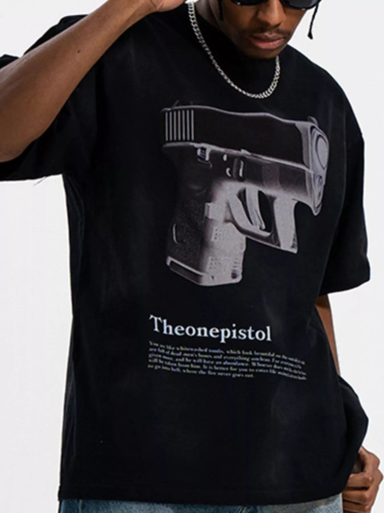 Men's Graphic Round Neck Oversized T-Shirt featuring a bold gun design in black and white.