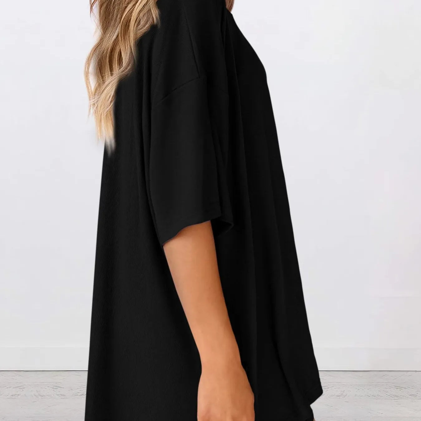 Full Size Oversized Slit Round Neck Top and Shorts Lounge Set Plus Size in black viewed from the side.