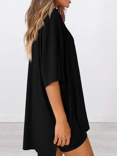 Full Size Oversized Slit Round Neck Top and Shorts Lounge Set Plus Size in black viewed from the side.