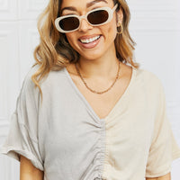 Smiling woman wearing Oval Full Rim Sunglasses, showcasing casual style and confidence.