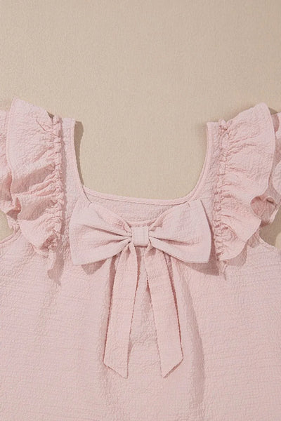 Textured Bow Knot Frilled Butterfly Sleeve Blouse with ruffled sleeves and a bow detail in soft pink.