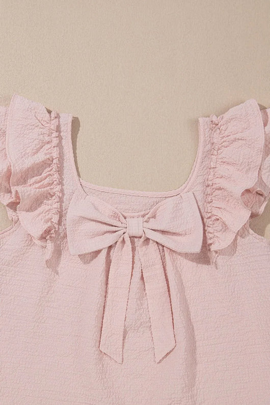 Textured Bow Knot Frilled Butterfly Sleeve Blouse with ruffled sleeves and a bow detail in soft pink.