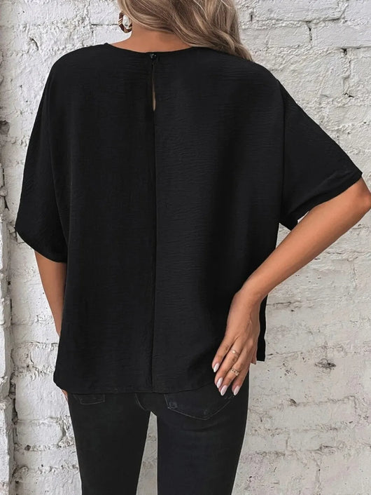 Knotted Round Neck Half Sleeve Blouse in black with back button detail and relaxed fit.