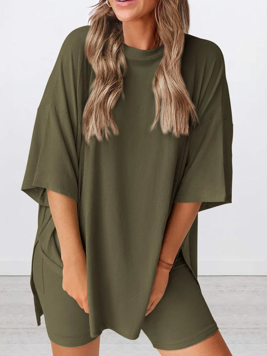 Full Size Oversized Slit Round Neck Top and Shorts Lounge Set Plus Size in olive green worn by a model.