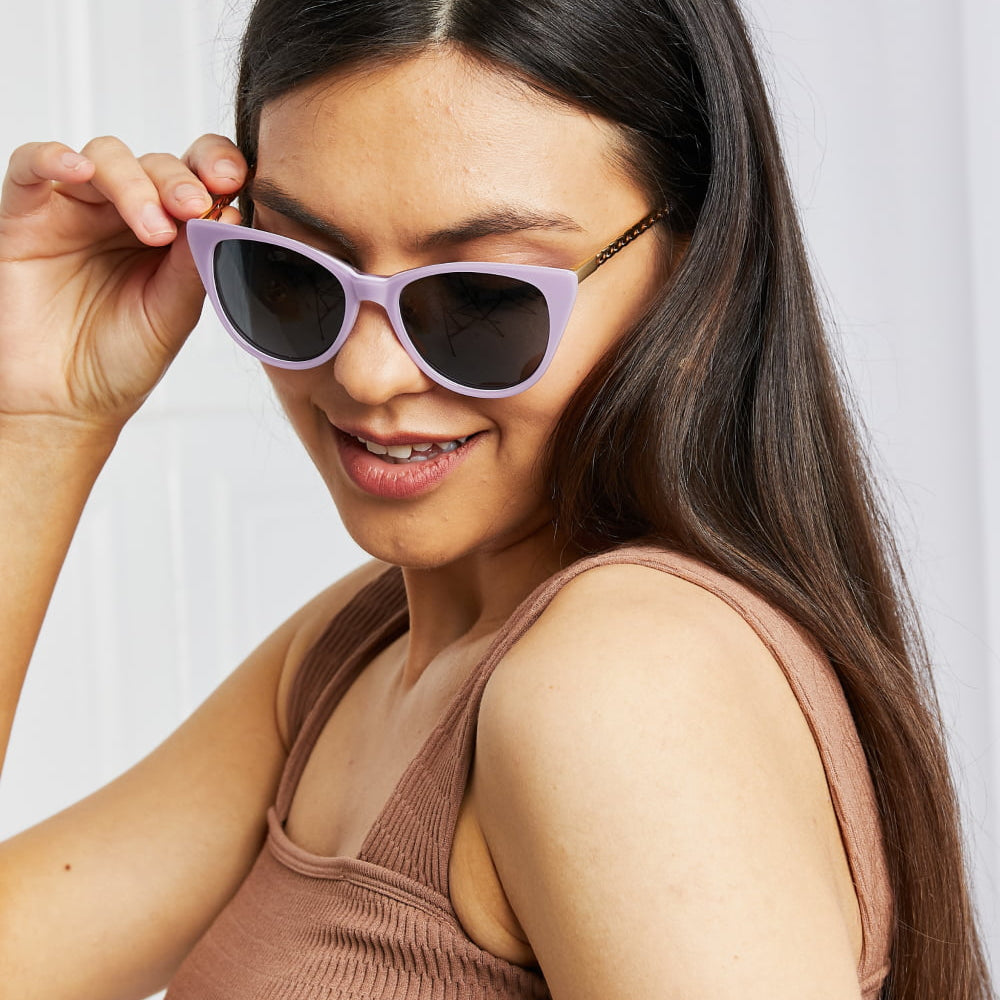 Cat-Eye Acetate Frame Sunglasses worn by a woman with long hair, showcasing a stylish purple frame.