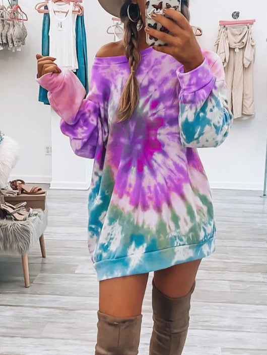 Full Size Tie-Dye Round Neck Long Sleeve Dress worn with knee-high boots, showcasing vibrant colors and relaxed style.