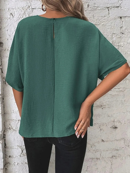 Knotted Round Neck Half Sleeve Blouse in green worn from the back with a keyhole detail and relaxed fit.
