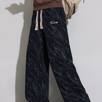 Men's Wide Leg Casual Pants with drawstring in stylish black marble pattern, perfect for casual wear.