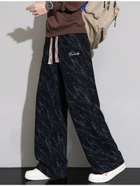 Men's Wide Leg Casual Pants with drawstring in stylish black marble pattern, perfect for casual wear.