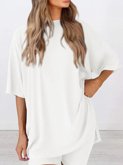 Full Size Oversized Slit Round Neck Top and Shorts Lounge Set Plus Size model wearing a white oversized top.