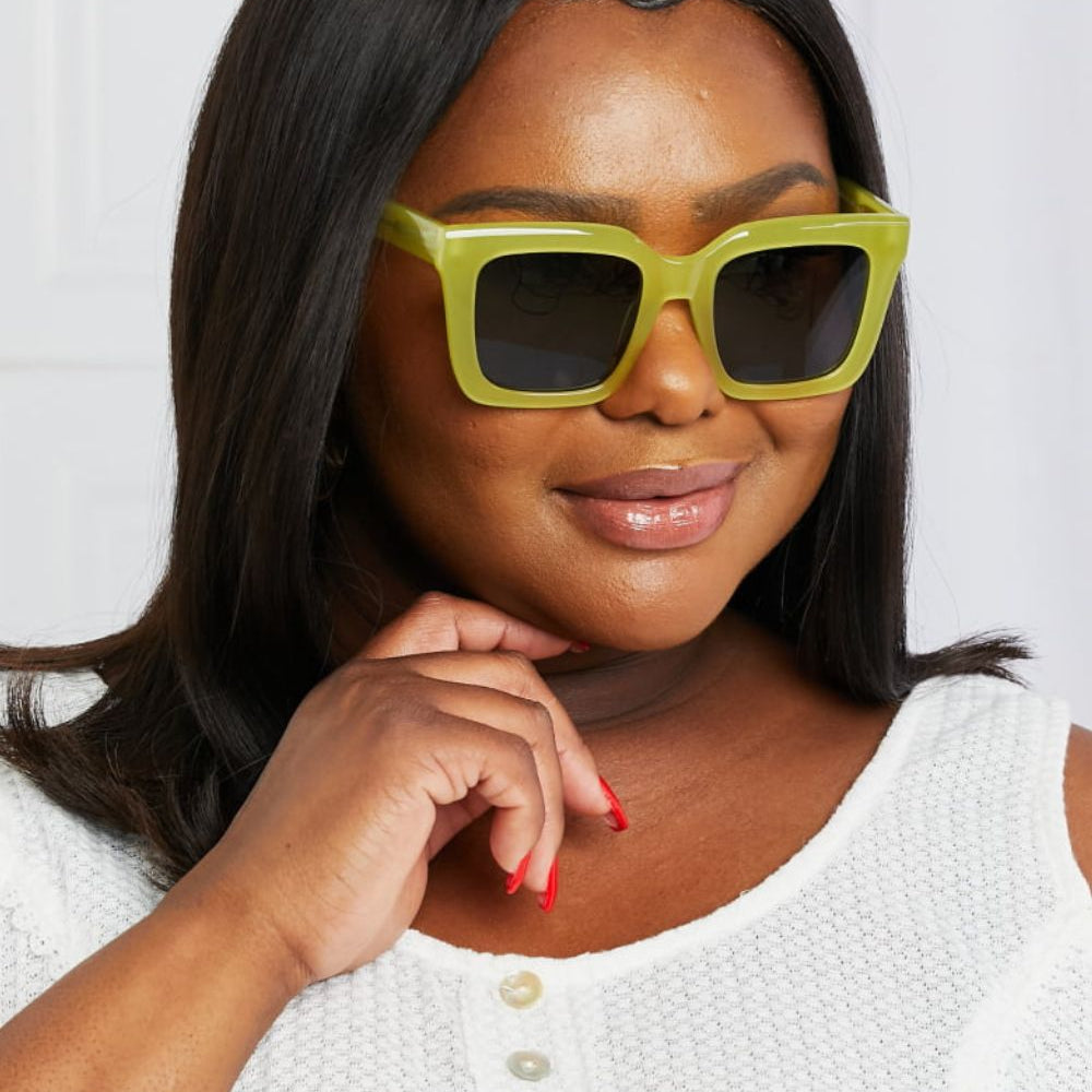 Square TAC Polarization Lens Sunglasses in green worn by a woman with black hair.