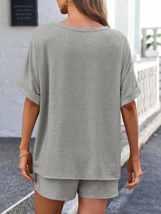 Back view of a model wearing a Round Neck T-Shirt and Drawstring Shorts Set in gray, showcasing its casual style.