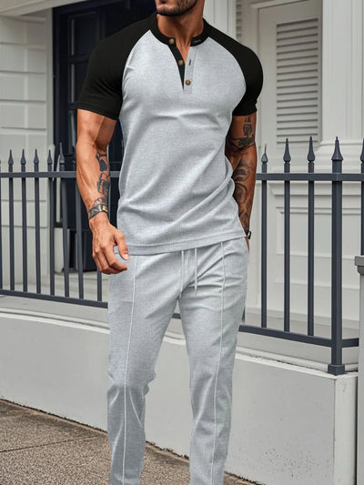 Men's Full Size Waffle-Knit Contrast Top and Drawstring Pants Set Plus Size model wearing stylish outfit outdoors.