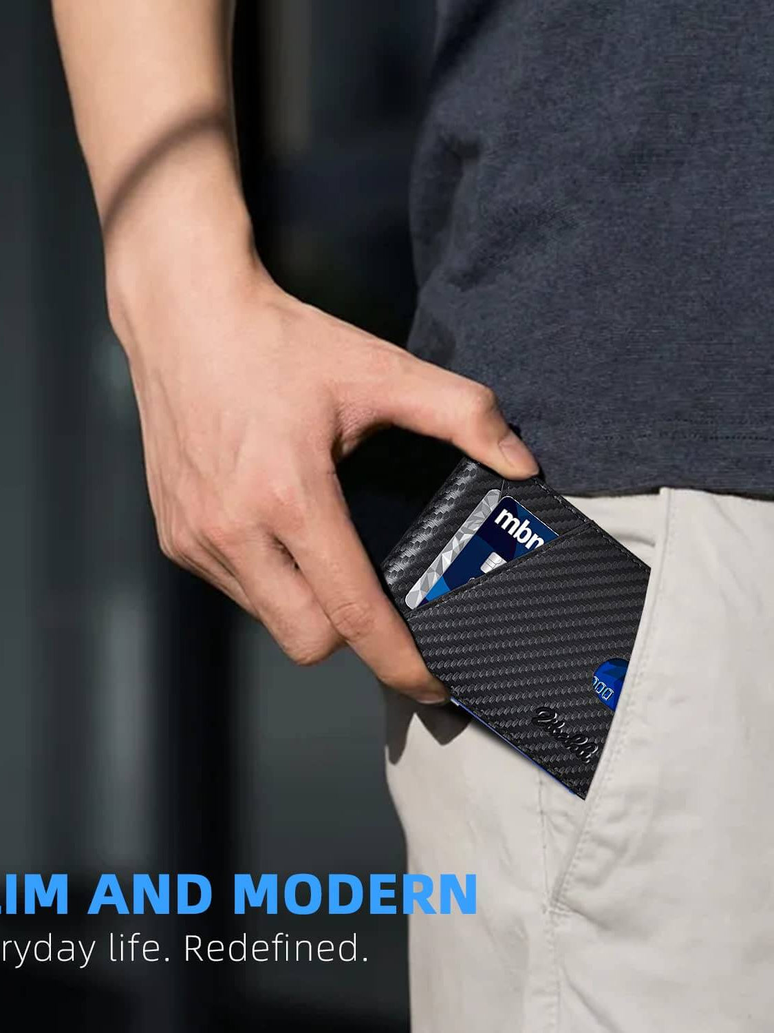 Slim and modern wallet being pulled from pocket, showcasing its minimalist design and sleek carbon black finish.