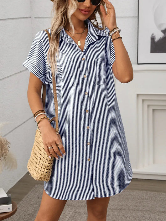 Striped Button Down Short Sleeve Mini Dress on a model wearing it with a casual bag in a modern setting.