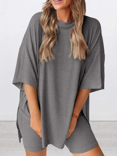 Full Size Oversized Slit Round Neck Top and Shorts Lounge Set Plus Size in gray, featuring a relaxed fit and slight stretch.