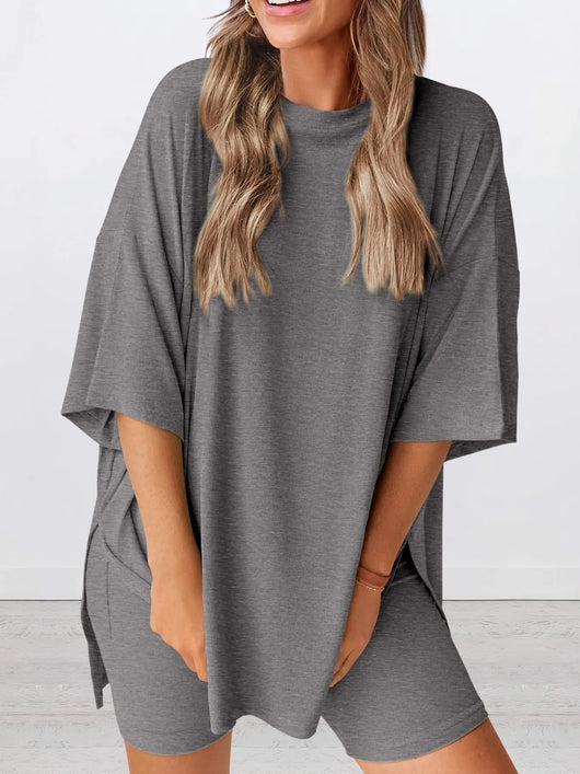 Full Size Oversized Slit Round Neck Top and Shorts Lounge Set Plus Size in gray, featuring a relaxed fit and slight stretch.