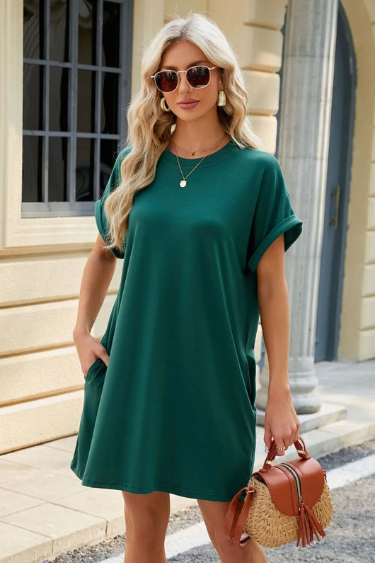 Florira Short Sleeve Mini Dress with Pockets in green, featuring rolled sleeves and side pockets.
