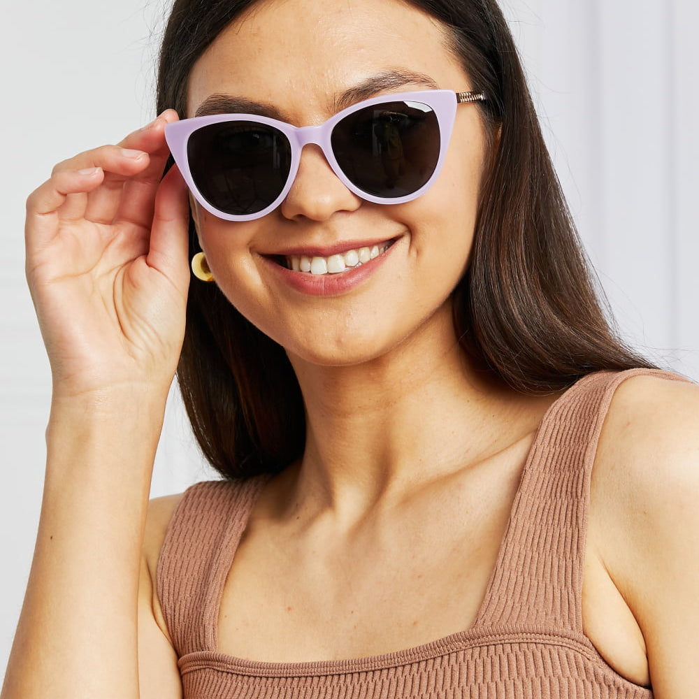 Cat-Eye Acetate Frame Sunglasses in lavender worn by a smiling woman, showcasing unique style and UV400 protection.