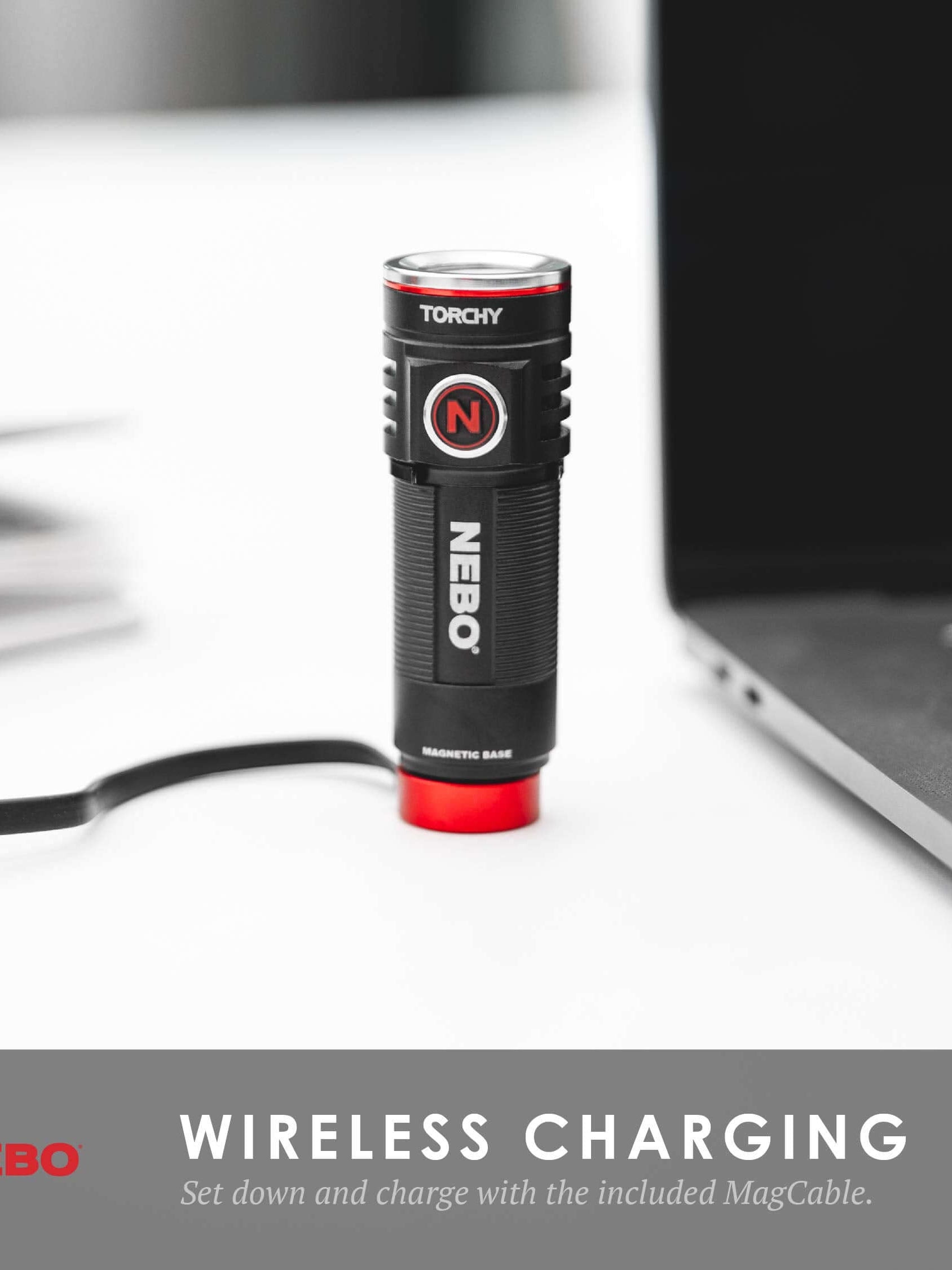 NEBO Torchy pocket flashlight charging with MagCable, showcasing its wireless charging feature on a desk.