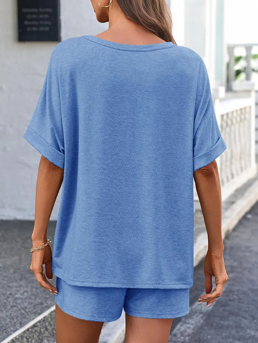 Back view of a woman wearing a Round Neck T-Shirt and Drawstring Shorts Set in blue.