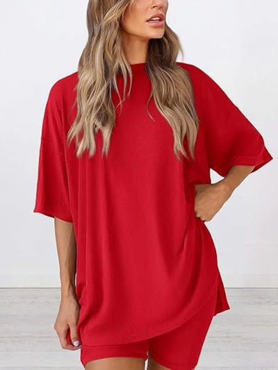 Full Size Oversized Slit Round Neck Top and Shorts Lounge Set Plus Size in vibrant red color, showcasing relaxed fit.