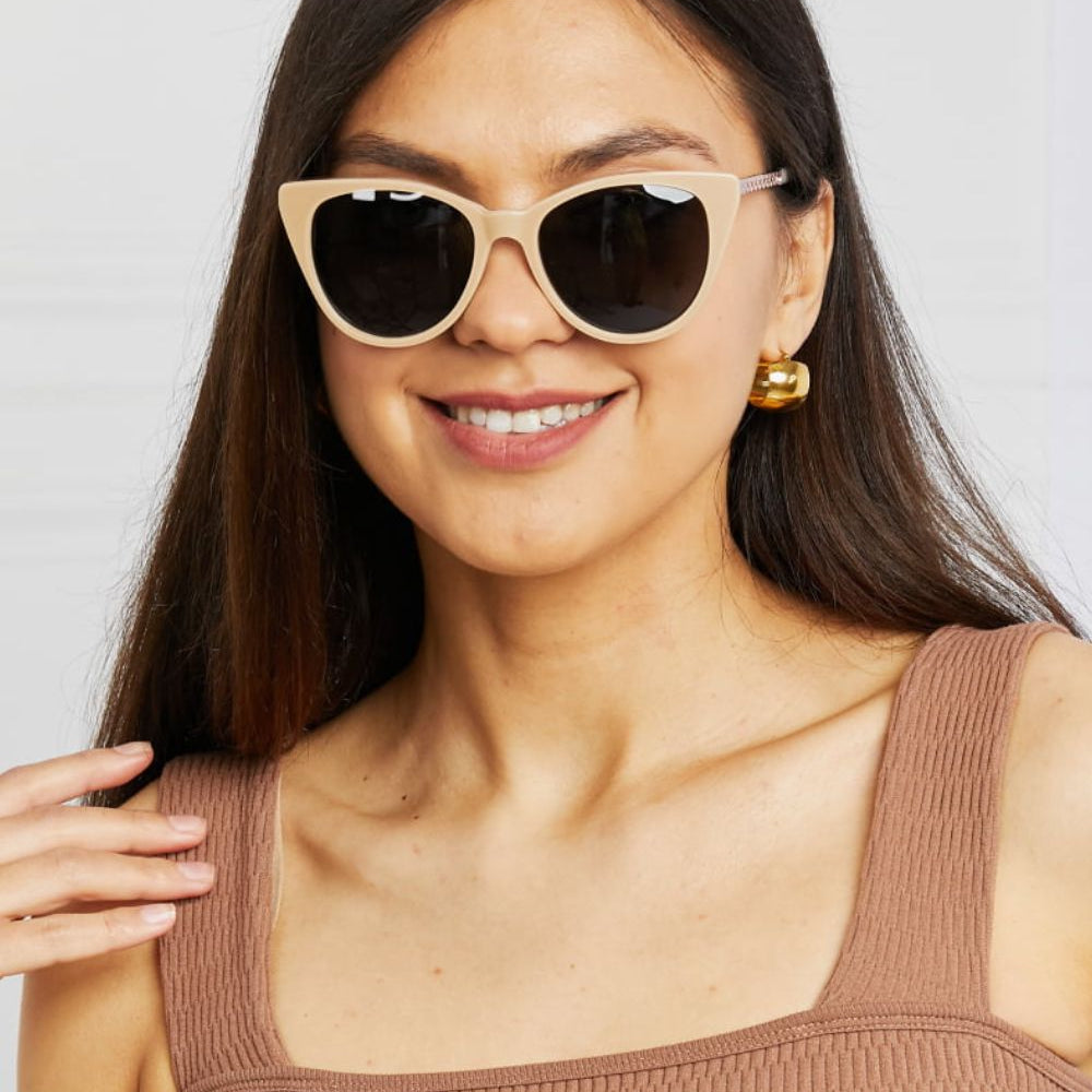Woman wearing Cat-Eye Acetate Frame Sunglasses, showcasing stylish design and UV protection.