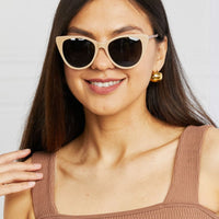 Woman wearing Cat-Eye Acetate Frame Sunglasses, showcasing stylish design and UV protection.