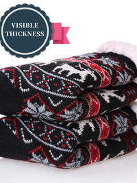 Cozy black winter slipper socks with festive design, showcasing visible thickness and soft fleece lining for warmth.