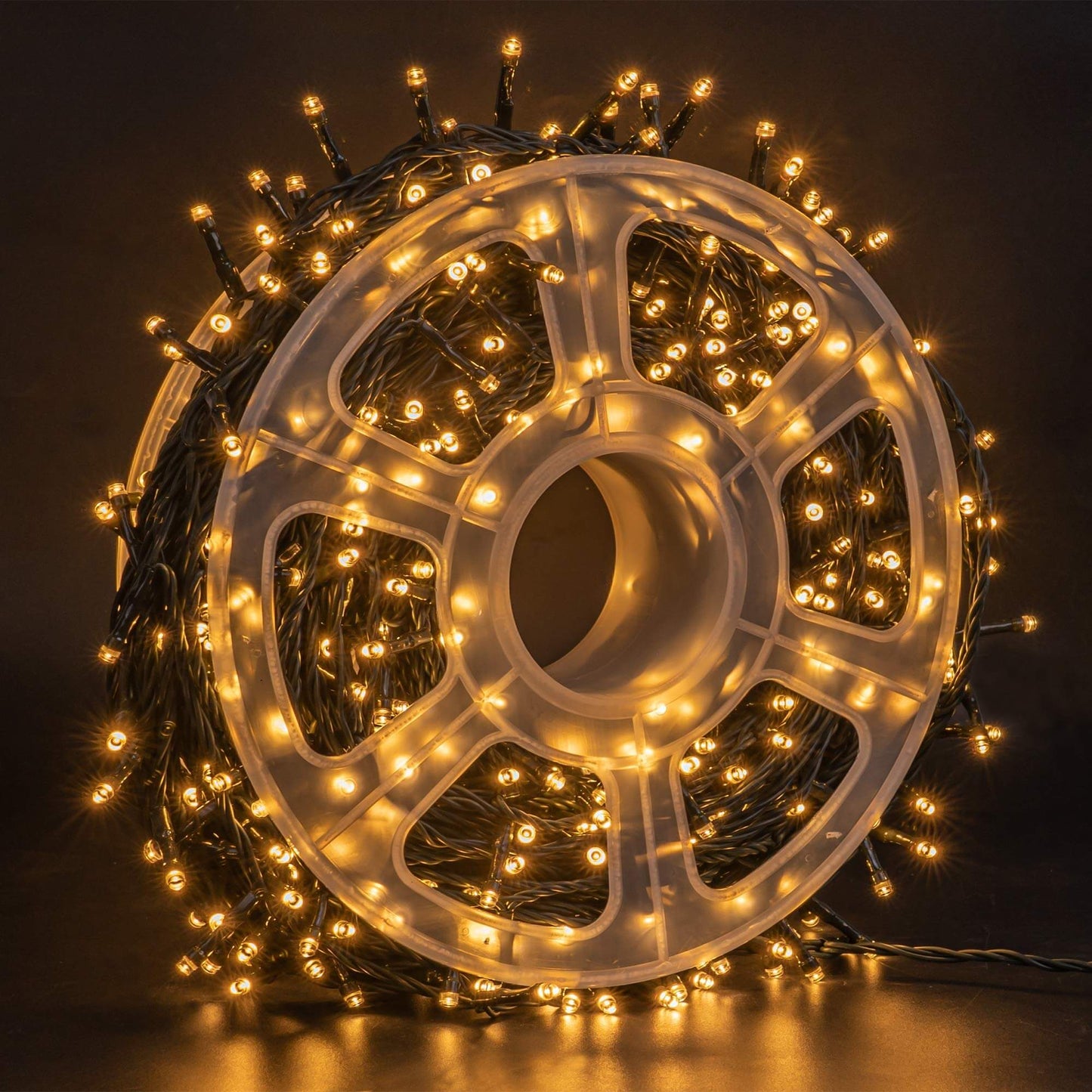 FUNPENY 500 LED warm white string lights on a spool, perfect for indoor and outdoor Christmas decoration.