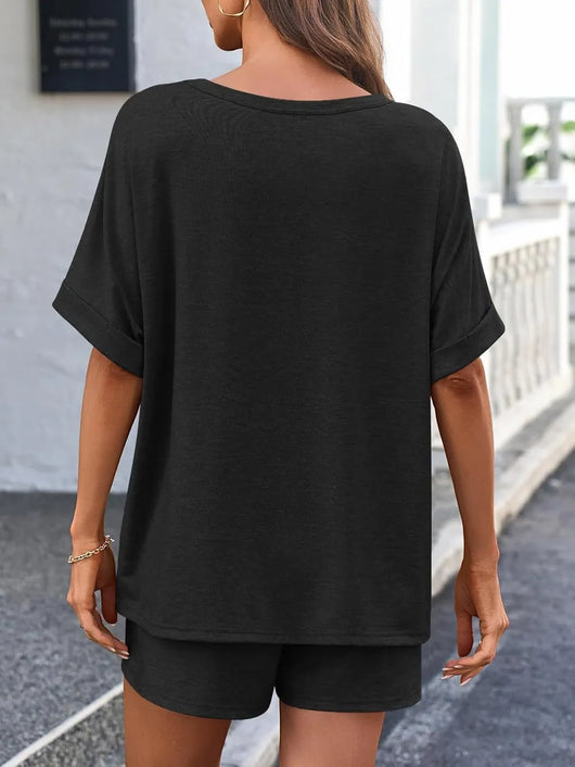 Back view of a woman wearing a Round Neck T-Shirt and Drawstring Shorts Set in black, showcasing casual comfort.