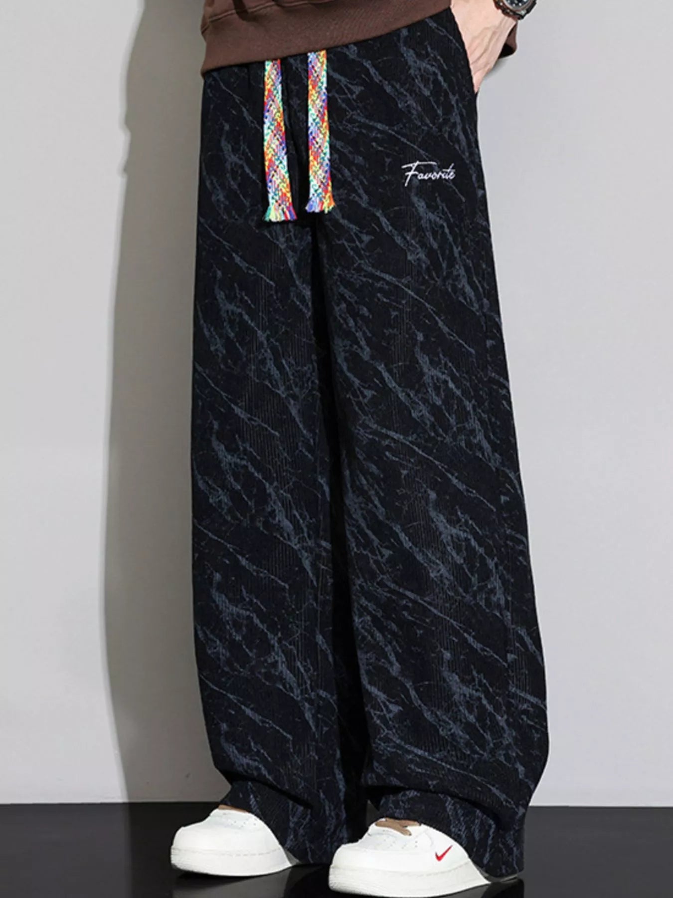 Men's Wide Leg Casual Pants featuring a drawstring design and stylish pattern.