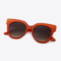 UV400 Polycarbonate Round Sunglasses in bold red with dark lenses, showcasing stylish design and modern frame.