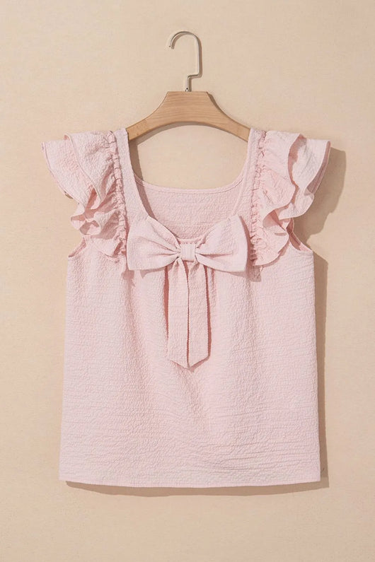 Textured Bow Knot Frilled Butterfly Sleeve Blouse on a wooden hanger against a beige background.